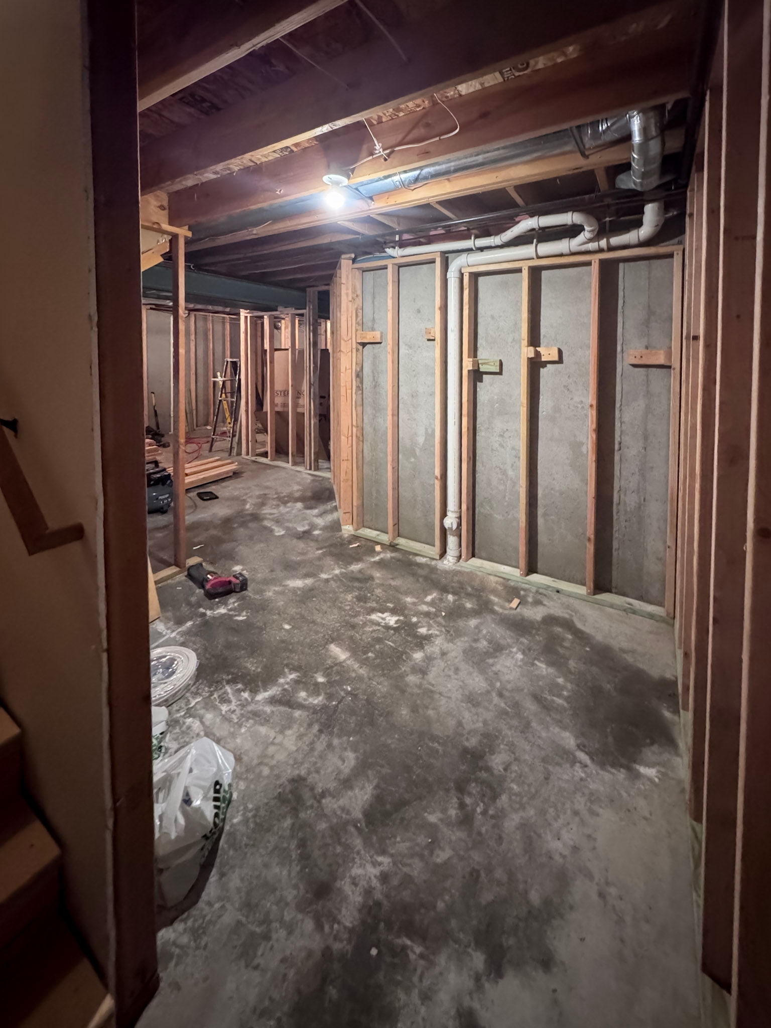 Framed room with new plumbing rough-in for the basement bathroom
