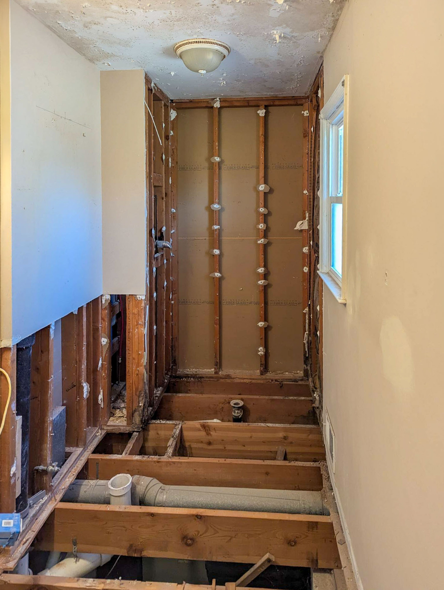 Bathroom stripped to the studs during construction