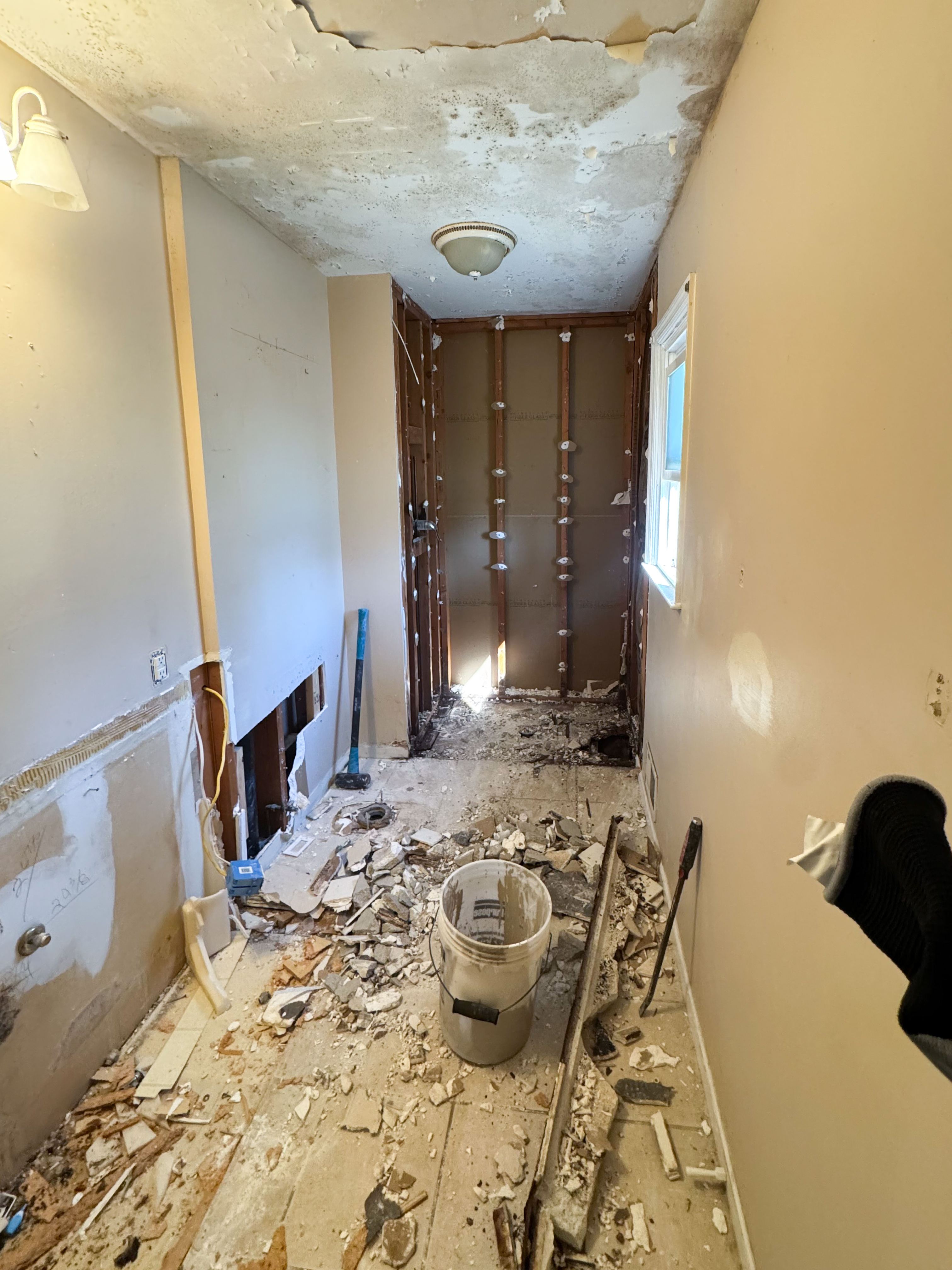 Bathroom subfloor and debris during construction