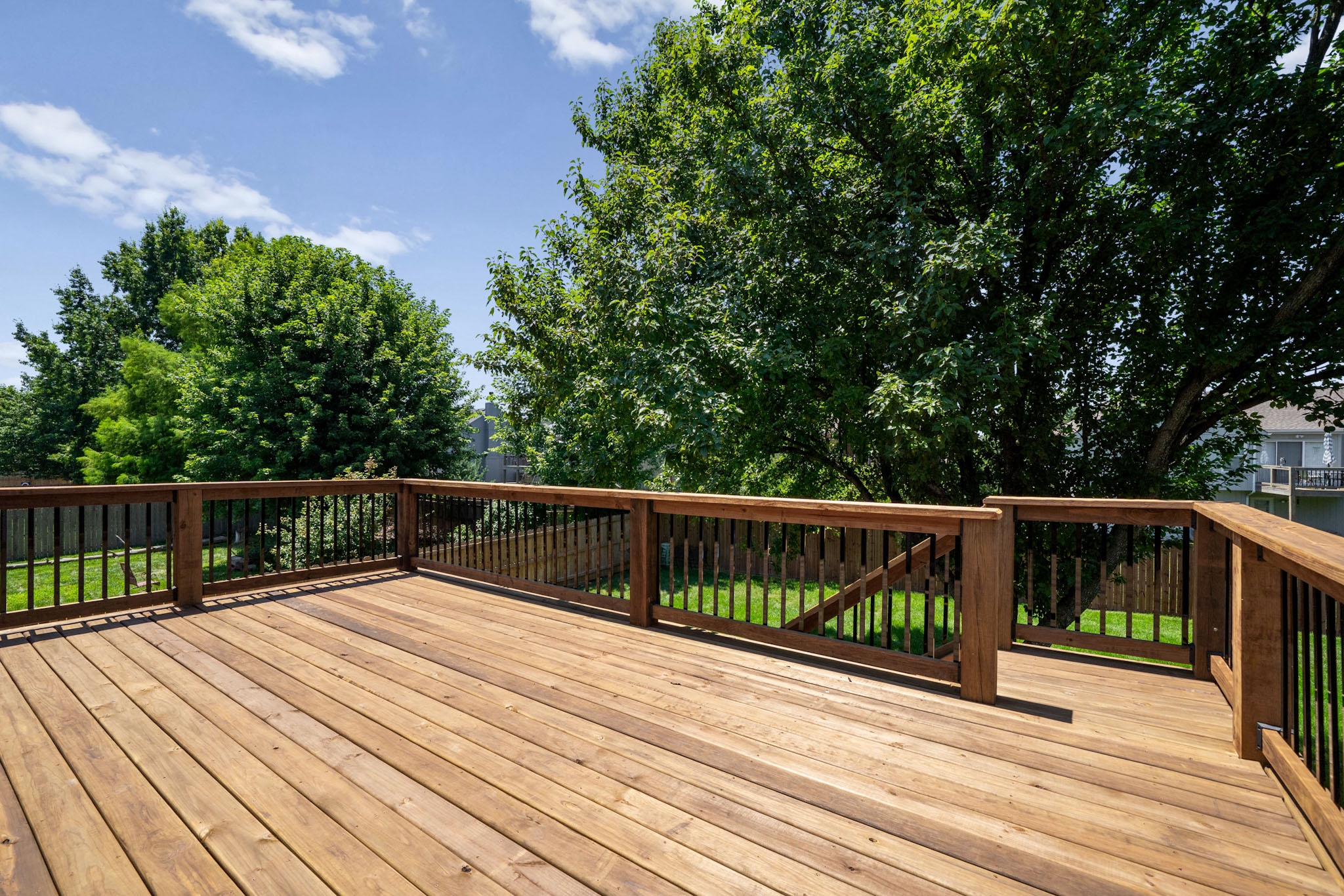 View from the finished deck looking out over the backyard