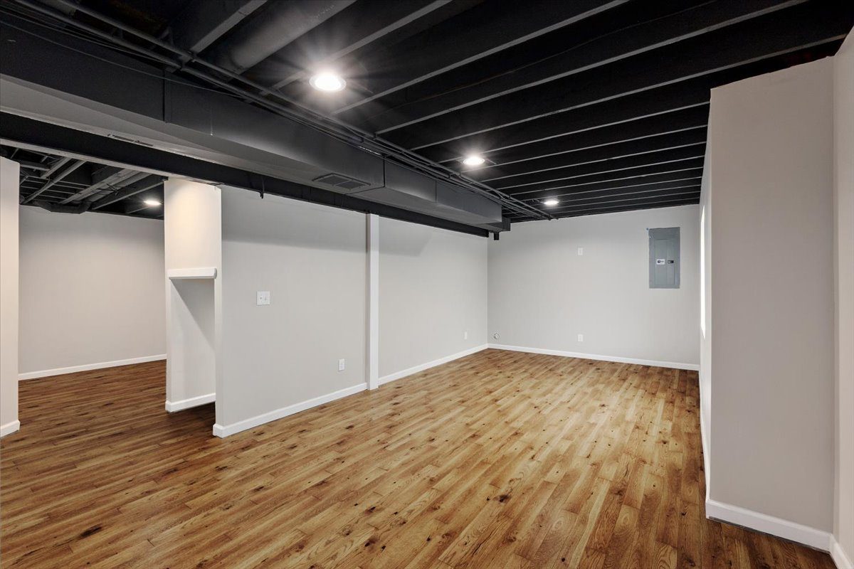 Finished basement with wood flooring